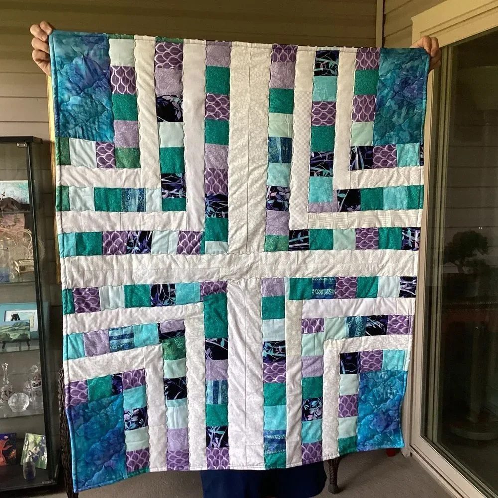 NWT. Hand Crafted Quilt of Blues, Purples and Turquoises